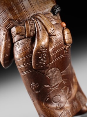 Lot 282 - GYOKUSO: A SUPERB SO SCHOOL INLAID WOOD NETSUKE OF A NOH ACTOR WEARING AN OKAME MASK