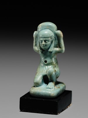 A GREEN FAIENCE AMULET OF SHU, THE GOD OF AIR AND ATMOSPHERE, LATE PERIOD, DYNASTY XXVI