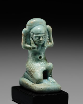 Lot 49 - A GREEN FAIENCE AMULET OF SHU, THE GOD OF AIR AND ATMOSPHERE, LATE PERIOD, DYNASTY XXVI