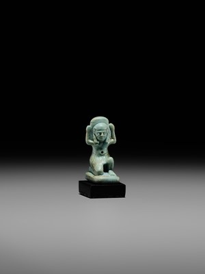 A GREEN FAIENCE AMULET OF SHU, THE GOD OF AIR AND ATMOSPHERE, LATE PERIOD, DYNASTY XXVI