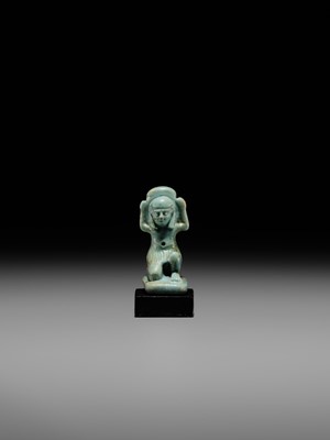 A GREEN FAIENCE AMULET OF SHU, THE GOD OF AIR AND ATMOSPHERE, LATE PERIOD, DYNASTY XXVI