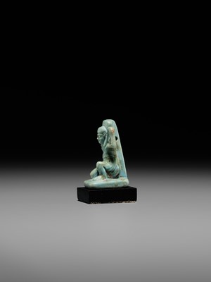 A GREEN FAIENCE AMULET OF SHU, THE GOD OF AIR AND ATMOSPHERE, LATE PERIOD, DYNASTY XXVI