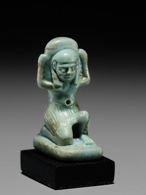 A GREEN FAIENCE AMULET OF SHU, THE GOD OF AIR AND ATMOSPHERE, LATE PERIOD, DYNASTY XXVI
