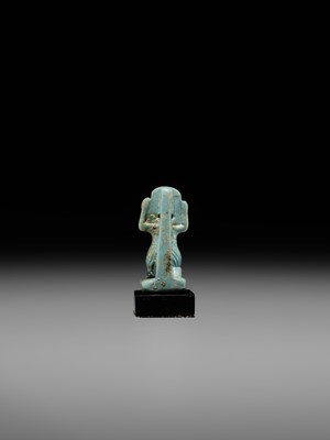 A GREEN FAIENCE AMULET OF SHU, THE GOD OF AIR AND ATMOSPHERE, LATE PERIOD, DYNASTY XXVI