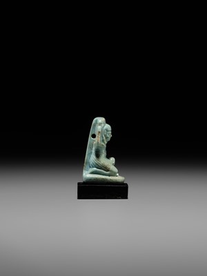 A GREEN FAIENCE AMULET OF SHU, THE GOD OF AIR AND ATMOSPHERE, LATE PERIOD, DYNASTY XXVI