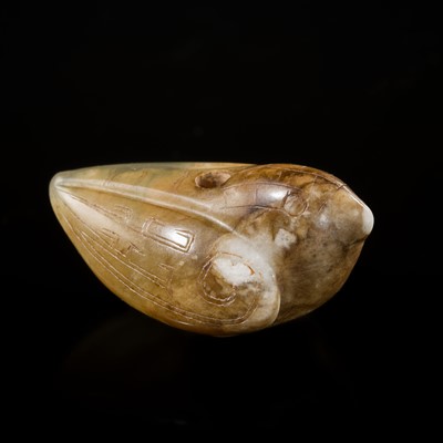 Lot 118 - A RARE CELADON AND BROWN JADE ‘BIRD’ PENDANT, LATE SHANG DYNASTY
