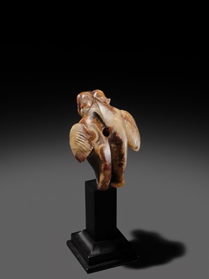 Lot 82 - AN AGATE AMULET IN THE FORM OF A LION-HEADED EAGLE, IMDUGUD, WESTERN ASIA, CIRCA THIRD MILLENNIUM BC