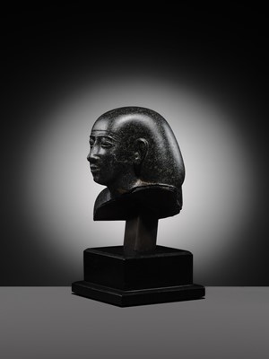 Lot 9 - AN INSCRIBED DIORITE BUST OF A ‘SOLE COMPANION’, SAITE PERIOD, DYNASTY XXVI