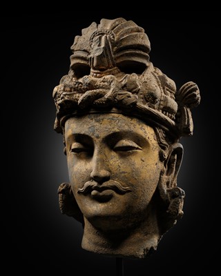 Lot 232 - A GILT-LACQUERED GRAY SCHIST HEAD OF A BODHISATTVA, ANCIENT REGION OF GANDHARA, 3RD-4TH CENTURY