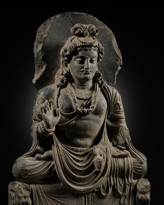 Lot 231 - A GRAY SCHIST FIGURE OF MAITREYA, ANCIENT REGION OF GANDHARA, 3RD CENTURY