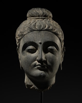 Lot 288 - A GRAY SCHIST HEAD OF BUDDHA, ANCIENT REGION OF GANDHARA, 3RD-4TH CENTURY