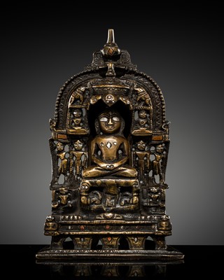Lot 350 - A JAIN COPPER- AND SILVER-INLAID BRASS SHRINE TO PARSHVANATHA, DATED 1297