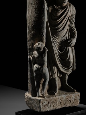 Lot 225 - A GRAY SCHIST FRIEZE OF BUDDHA DIPANKARA AND THE ASCETIC MEGHA, THE FUTURE BUDDHA SHAKYAMUNI, CIRCA 3RD CENTURY