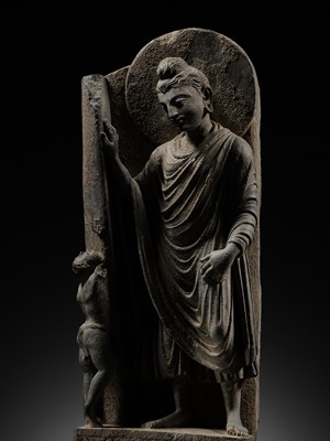 Lot 225 - A GRAY SCHIST FRIEZE OF BUDDHA DIPANKARA AND THE ASCETIC MEGHA, THE FUTURE BUDDHA SHAKYAMUNI, CIRCA 3RD CENTURY