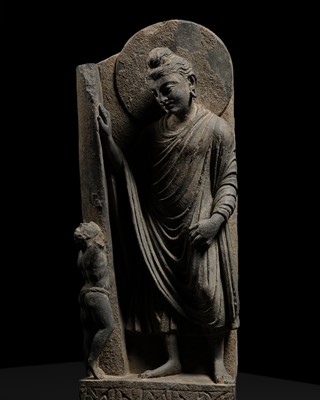 Lot 225 - A GRAY SCHIST FRIEZE OF BUDDHA DIPANKARA AND THE ASCETIC MEGHA, THE FUTURE BUDDHA SHAKYAMUNI, CIRCA 3RD CENTURY