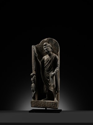 Lot 225 - A GRAY SCHIST FRIEZE OF BUDDHA DIPANKARA AND THE ASCETIC MEGHA, THE FUTURE BUDDHA SHAKYAMUNI, CIRCA 3RD CENTURY