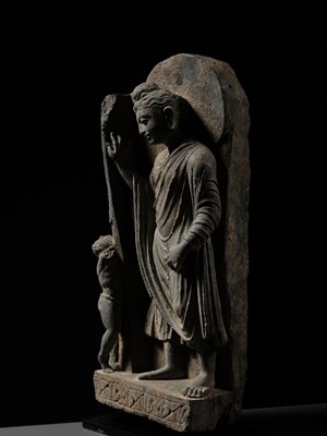 Lot 225 - A GRAY SCHIST FRIEZE OF BUDDHA DIPANKARA AND THE ASCETIC MEGHA, THE FUTURE BUDDHA SHAKYAMUNI, CIRCA 3RD CENTURY