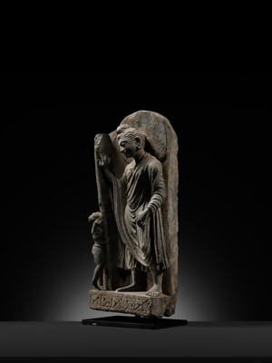 Lot 225 - A GRAY SCHIST FRIEZE OF BUDDHA DIPANKARA AND THE ASCETIC MEGHA, THE FUTURE BUDDHA SHAKYAMUNI, CIRCA 3RD CENTURY