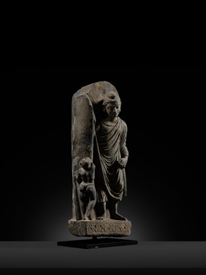 Lot 225 - A GRAY SCHIST FRIEZE OF BUDDHA DIPANKARA AND THE ASCETIC MEGHA, THE FUTURE BUDDHA SHAKYAMUNI, CIRCA 3RD CENTURY