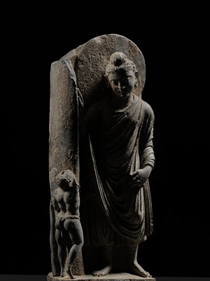 Lot 225 - A GRAY SCHIST FRIEZE OF BUDDHA DIPANKARA AND THE ASCETIC MEGHA, THE FUTURE BUDDHA SHAKYAMUNI, CIRCA 3RD CENTURY