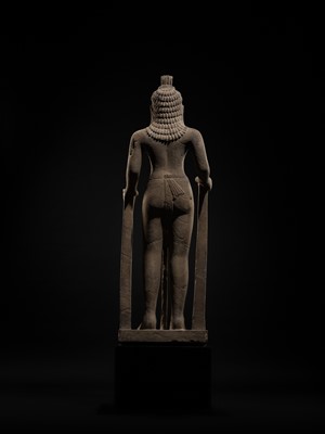 Lot 45 - AN IMPORTANT AND LARGE (131 CM) SANDSTONE FIGURE OF PARASHURAMA, PRE-ANGKOR PERIOD, PHNOM DA STYLE, 7TH CENTURY