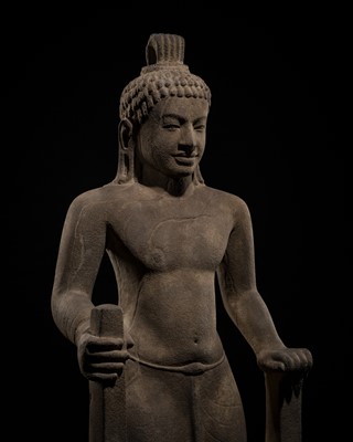 Lot 45 - AN IMPORTANT AND LARGE (131 CM) SANDSTONE FIGURE OF PARASHURAMA, PRE-ANGKOR PERIOD, PHNOM DA STYLE, 7TH CENTURY