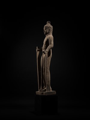 Lot 45 - AN IMPORTANT AND LARGE (131 CM) SANDSTONE FIGURE OF PARASHURAMA, PRE-ANGKOR PERIOD, PHNOM DA STYLE, 7TH CENTURY