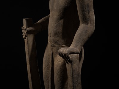 Lot 45 - AN IMPORTANT AND LARGE (131 CM) SANDSTONE FIGURE OF PARASHURAMA, PRE-ANGKOR PERIOD, PHNOM DA STYLE, 7TH CENTURY