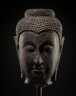 Lot 53 - A LACQUERED SANDSTONE HEAD OF AVALOKITESHVARA, AYUTTHAYA, 16TH-17TH CENTURY