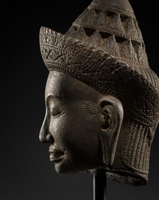 Lot 47 - A FINE SANDSTONE HEAD OF A MALE DEITY, BAPHUON STYLE, ANGKOR PERIOD