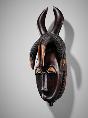 Lot 95 - A CARVED WOOD MASK, GYÈ, YAURE CULTURE, CÔTE D'IVOIRE, LATE 19TH TO EARLY 20TH CENTURY