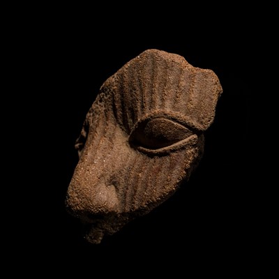 Lot 67 - A RARE TERRACOTTA FRAGMENT OF A FACE, IFE CULTURE, NIGERIA, 1000-1500