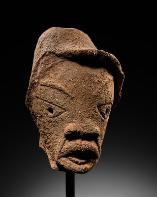 Lot 66 - A TERRACOTTA HEAD OF A MAN WEARING A HAT, NOK CULTURE, NIGERIA, 500 BC – 200 AD