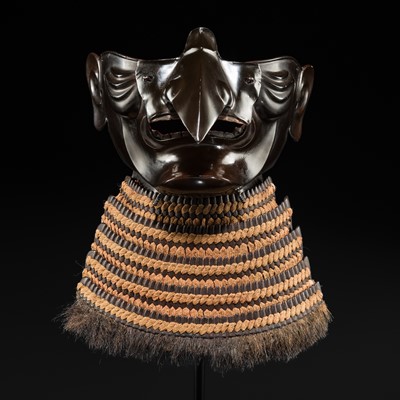 Lot 104 - A LACQUERED IRON TENGU MENPO