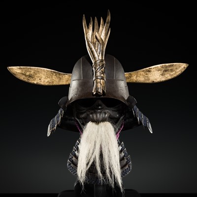 AN IMPRESSIVE LACQUERED IRON HINENO ZUNARI KABUTO AND RESSEI MENPO, WITH NKBKHK KICHO SHIRYO CERTIFICATE