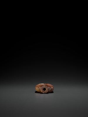 Lot 354 - A RUSSET JADE SNUFF BOTTLE, ‘MASTER OF THE ROCKS’ SCHOOL, QING DYNASTY