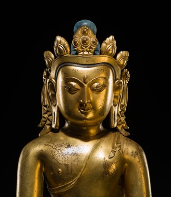A LARGE GILT-BRONZE FIGURE OF CROWNED BUDDHA