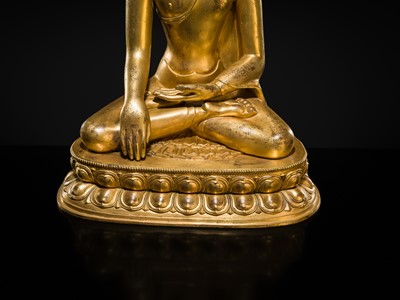 A LARGE GILT-BRONZE FIGURE OF CROWNED BUDDHA