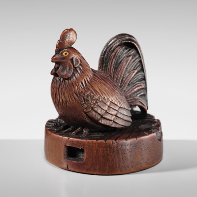 A WOOD NETSUKE OF A COCKEREL ON A CHAUSU TEA MILL