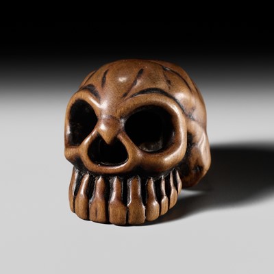 Lot 298 - YOSHITAKA: A WOOD NETSUKE OF A SKULL