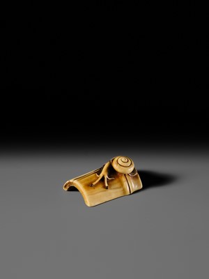 Lot 140 - HIDEMASA: A FINE OSAKA SCHOOL IVORY NETSUKE OF A SNAIL ON BAMBOO