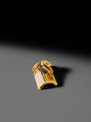 Lot 140 - HIDEMASA: A FINE OSAKA SCHOOL IVORY NETSUKE OF A SNAIL ON BAMBOO