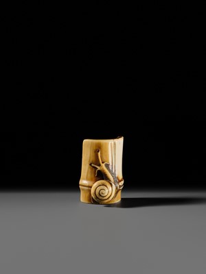 Lot 140 - HIDEMASA: A FINE OSAKA SCHOOL IVORY NETSUKE OF A SNAIL ON BAMBOO