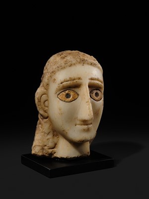 Lot 61 - A RARE ALABASTER HEAD OF A WOMAN, ANCIENT KINGDOM OF SABA