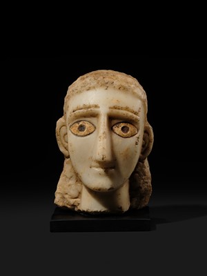 Lot 61 - A RARE ALABASTER HEAD OF A WOMAN, ANCIENT KINGDOM OF SABA