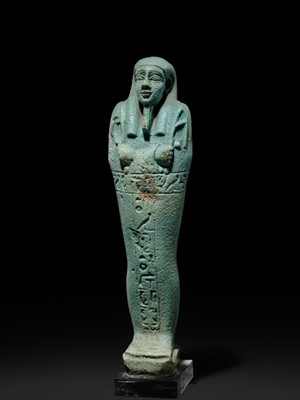 Lot 56 - A SUPERB PALE BLUE FAIENCE SHABTI OF NESBANEBDJED, DYNASTY XXX