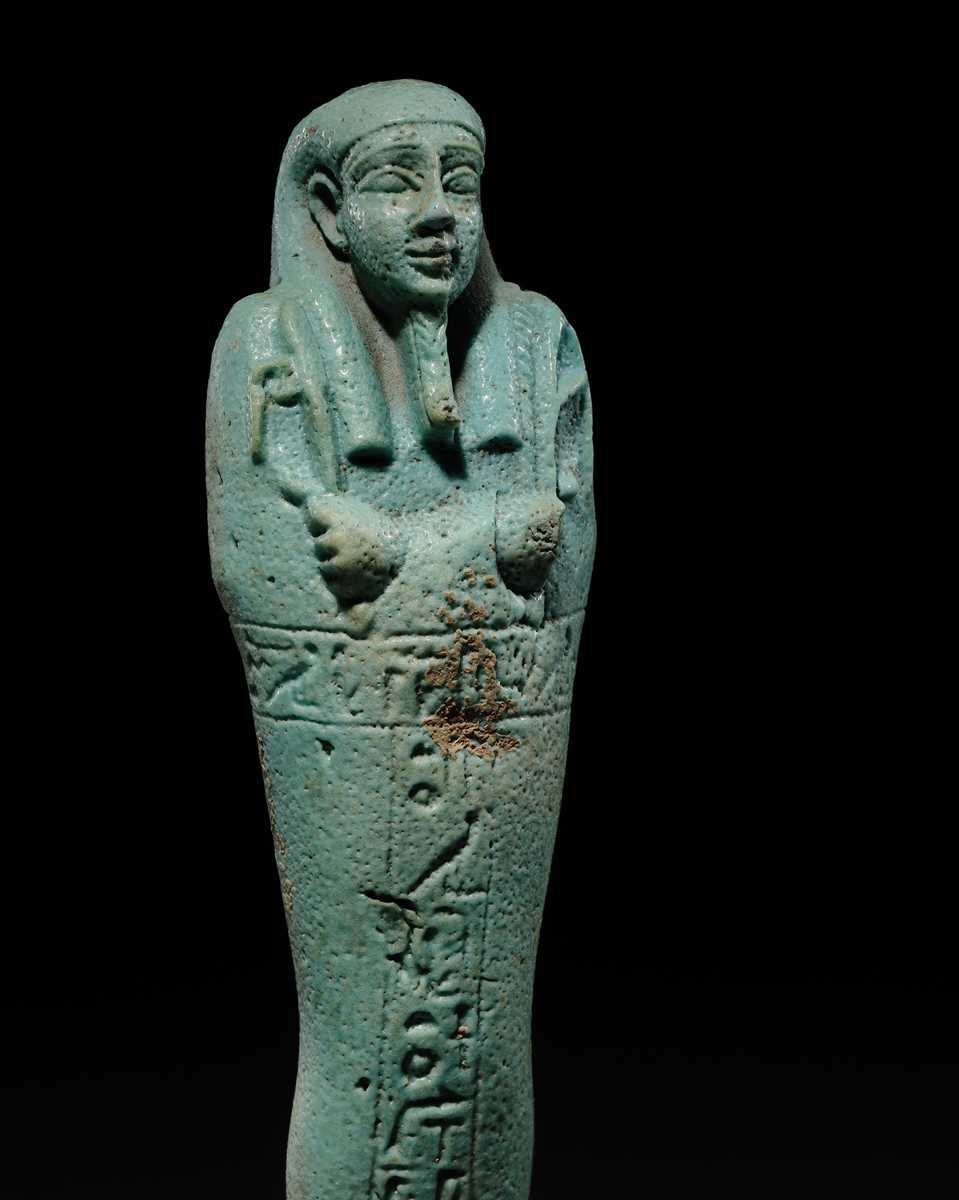 Lot 56 - A SUPERB PALE BLUE FAIENCE SHABTI OF NESBANEBDJED, DYNASTY XXX