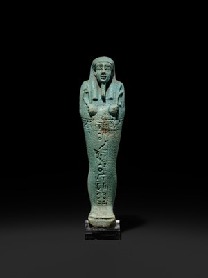 Lot 56 - A SUPERB PALE BLUE FAIENCE SHABTI OF NESBANEBDJED, DYNASTY XXX