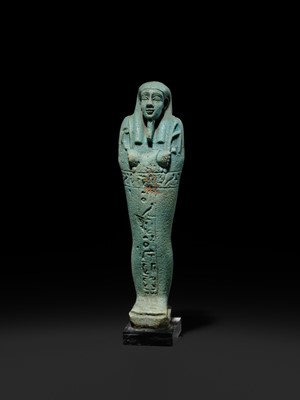 Lot 56 - A SUPERB PALE BLUE FAIENCE SHABTI OF NESBANEBDJED, DYNASTY XXX