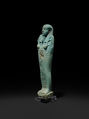 Lot 56 - A SUPERB PALE BLUE FAIENCE SHABTI OF NESBANEBDJED, DYNASTY XXX